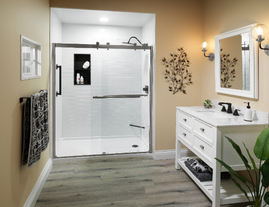 White walk-in shower with black frame and grab bar